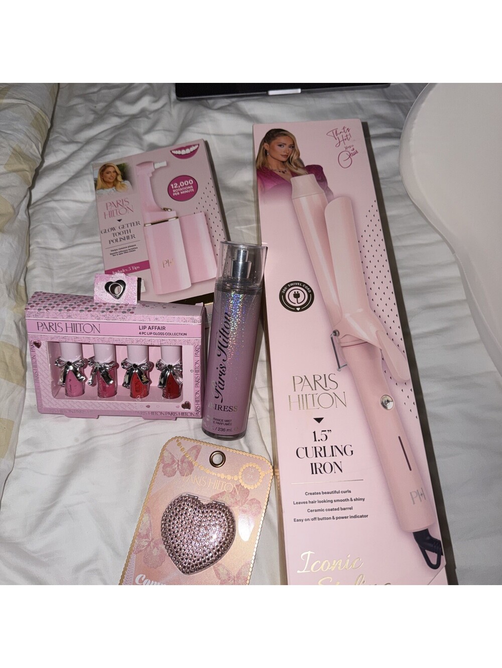 Paris Hilton  Bundle Lip Gloss, Tooth Polisher, Mirror, Body Mist, Curling Iron